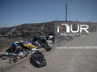 Clothes are being left on the street for residents affected by the mega fire in Villa Independencia. (