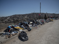 Clothes are being left on the street for residents affected by the mega fire in Villa Independencia. (