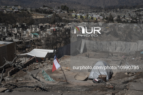 A tent is left in a house affected by the mega forest fire in the Valparaiso region. 