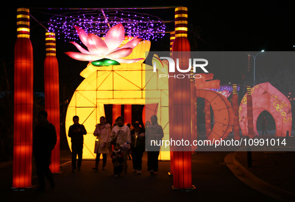 Tourists are enjoying colored lanterns at the Bali Lake Lunar Year Night Tour Cultural Festival in Jiujiang, China, on February 12, 2024. 