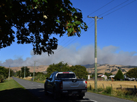 Smoke is rising thickly from a fire in Christchurch, New Zealand, on February 14, 2024. Authorities are declaring a local state of emergency...