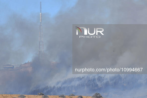 Smoke is rising thickly from a fire in Christchurch, New Zealand, on February 14, 2024. Authorities are declaring a local state of emergency...