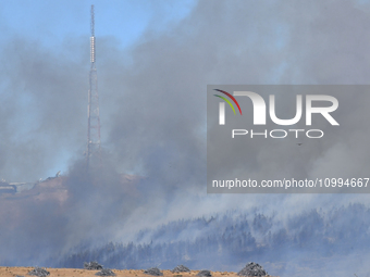 Smoke is rising thickly from a fire in Christchurch, New Zealand, on February 14, 2024. Authorities are declaring a local state of emergency...