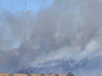 Smoke is rising thickly from a fire in Christchurch, New Zealand, on February 14, 2024. Authorities are declaring a local state of emergency...