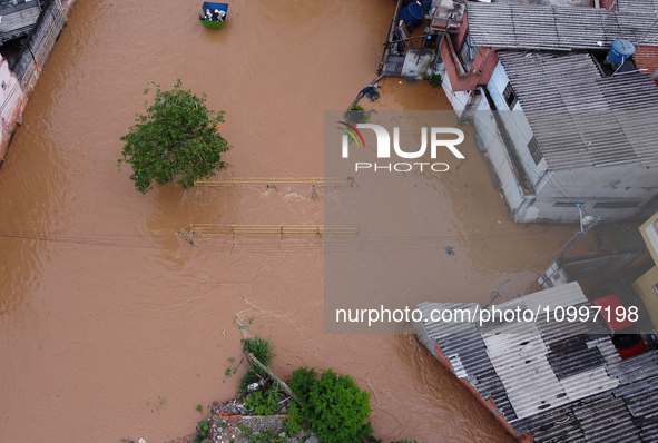 Intense rain is causing disruption in the cities of Carapicuiba and Itapevi, in Sao Paulo, Brazil, on April 13, 2023, leading to several poi...