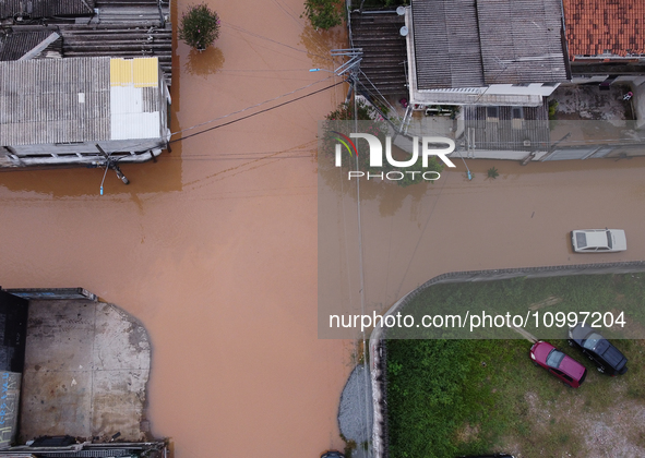 Intense rain is causing disruption in the cities of Carapicuiba and Itapevi, in Sao Paulo, Brazil, on April 13, 2023, leading to several poi...