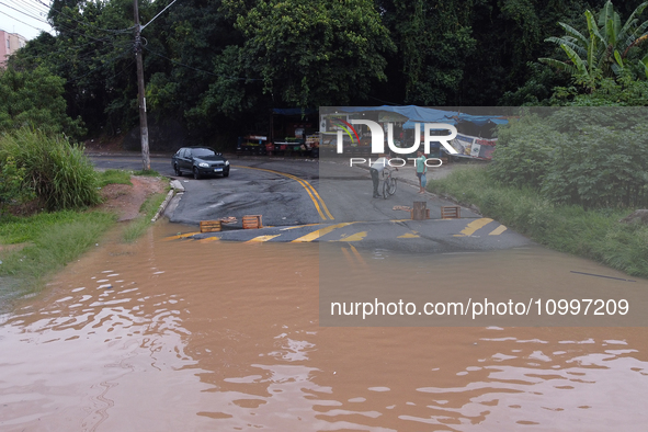 Intense rain is causing disruption in the cities of Carapicuiba and Itapevi, in Sao Paulo, Brazil, on April 13, 2023, leading to several poi...