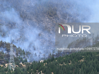 Smoke is rising from a vegetation fire in Port Hills, Canterbury region, New Zealand, on February 15, 2024. (