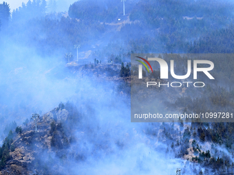 Smoke is rising from a vegetation fire in Port Hills, Canterbury region, New Zealand, on February 15, 2024. (