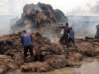 Firefighters are extinguishing a fire that has broken out at a Jute Corporation of India godown in the Bhuragaon area of Morigaon district,...