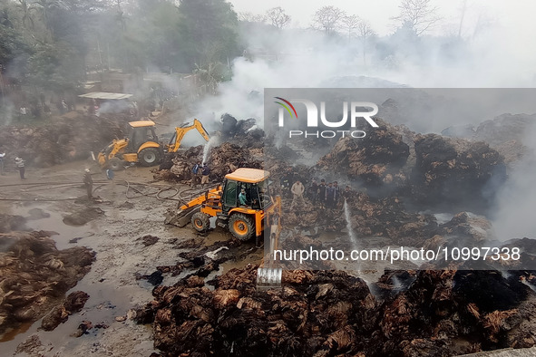 Firefighters are using JCB machines to extinguish a fire that has broken out at a Jute Corporation of India godown in the Bhuragaon area of...