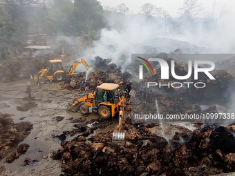 Firefighters are using JCB machines to extinguish a fire that has broken out at a Jute Corporation of India godown in the Bhuragaon area of...