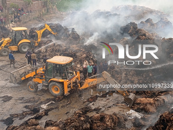 Firefighters are using JCB machines to extinguish a fire that has broken out at a Jute Corporation of India godown in the Bhuragaon area of...