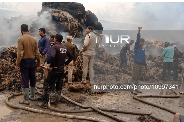 Firefighters are extinguishing a fire that has broken out at a Jute Corporation of India godown in the Bhuragaon area of Morigaon district,...