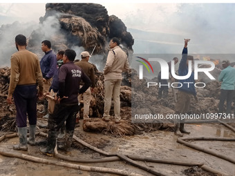 Firefighters are extinguishing a fire that has broken out at a Jute Corporation of India godown in the Bhuragaon area of Morigaon district,...