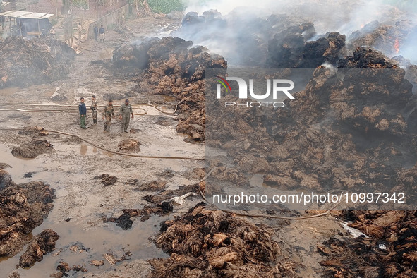 Firefighters are extinguishing a fire that has broken out at a Jute Corporation of India godown in the Bhuragaon area of Morigaon district,...