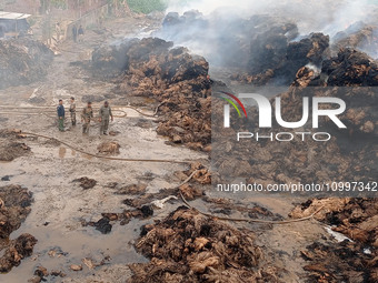 Firefighters are extinguishing a fire that has broken out at a Jute Corporation of India godown in the Bhuragaon area of Morigaon district,...