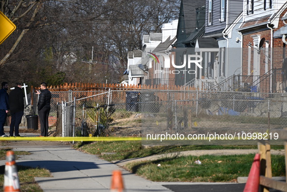 Investigators are searching a residence and gathering evidence on Hanna Place Southeast in Washington, DC, United States, on February 15, 20...