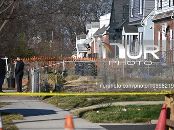 Investigators are searching a residence and gathering evidence on Hanna Place Southeast in Washington, DC, United States, on February 15, 20...