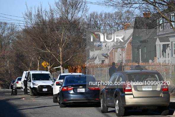 Investigators are searching a residence and gathering evidence on Hanna Place Southeast in Washington, DC, United States, on February 15, 20...