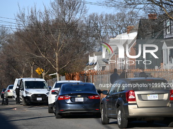 Investigators are searching a residence and gathering evidence on Hanna Place Southeast in Washington, DC, United States, on February 15, 20...