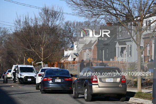 Investigators are searching a residence and gathering evidence on Hanna Place Southeast in Washington, DC, United States, on February 15, 20...