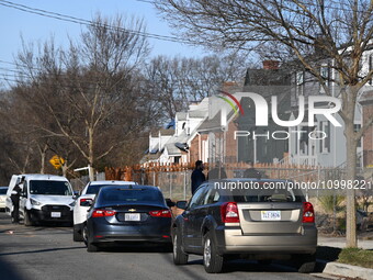 Investigators are searching a residence and gathering evidence on Hanna Place Southeast in Washington, DC, United States, on February 15, 20...