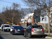 Investigators are searching a residence and gathering evidence on Hanna Place Southeast in Washington, DC, United States, on February 15, 20...