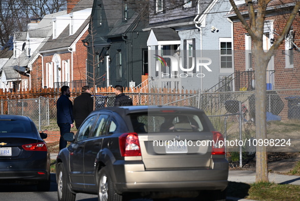 Investigators are searching a residence and gathering evidence on Hanna Place Southeast in Washington, DC, United States, on February 15, 20...