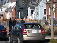 Investigators are searching a residence and gathering evidence on Hanna Place Southeast in Washington, DC, United States, on February 15, 20...