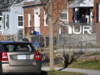 Investigators are searching a residence and gathering evidence on Hanna Place Southeast in Washington, DC, United States, on February 15, 20...