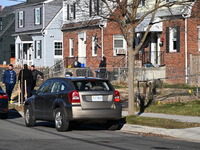 Investigators are searching a residence and gathering evidence on Hanna Place Southeast in Washington, DC, United States, on February 15, 20...