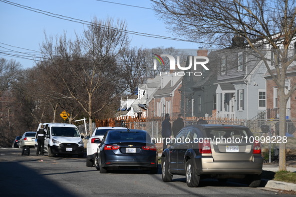 Investigators are searching a residence and gathering evidence on Hanna Place Southeast in Washington, DC, United States, on February 15, 20...