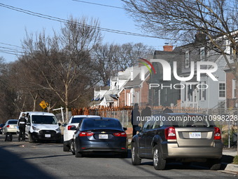 Investigators are searching a residence and gathering evidence on Hanna Place Southeast in Washington, DC, United States, on February 15, 20...