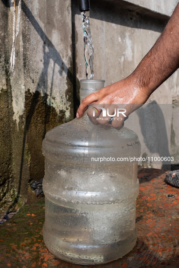 A Man Collects Drinking Water From A Local Deep Water Tap At Sayedabad In Dhaka, Bangladesh On February 16, 2024. Locals Said That The Water...