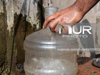 A Man Collects Drinking Water From A Local Deep Water Tap At Sayedabad In Dhaka, Bangladesh On February 16, 2024. Locals Said That The Water...