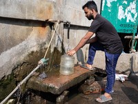 A Man Collects Drinking Water From A Local Deep Water Tap At Sayedabad In Dhaka, Bangladesh On February 16, 2024. Locals Said That The Water...