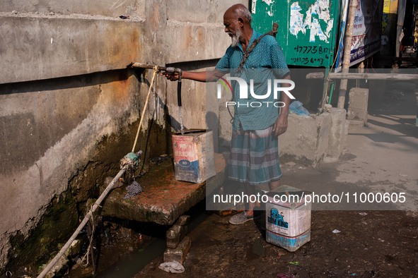 A Man Collects Drinking Water From A Local Deep Water Tap At Sayedabad In Dhaka, Bangladesh On February 16, 2024. Locals Said That The Water...