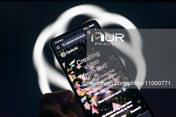 The Sora model text-to-video is being displayed on a smartphone with the OpenAI logo visible in the background in this photo illustration in...