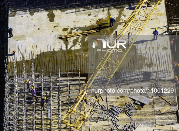 Workers are reinforcing the Yundong Gate at the construction site for the Subei Irrigation Canal in Huai'an, China, on February 16, 2024. 