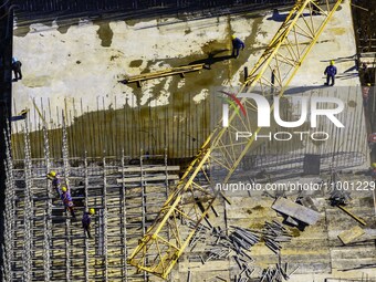 Workers are reinforcing the Yundong Gate at the construction site for the Subei Irrigation Canal in Huai'an, China, on February 16, 2024. (