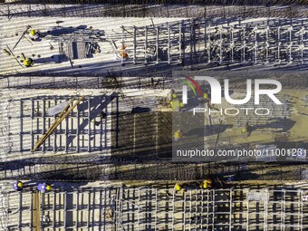 Workers are reinforcing the Yundong Gate at the construction site for the Subei Irrigation Canal in Huai'an, China, on February 16, 2024. (