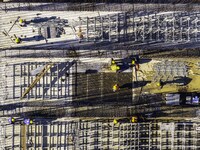 Workers are reinforcing the Yundong Gate at the construction site for the Subei Irrigation Canal in Huai'an, China, on February 16, 2024. (