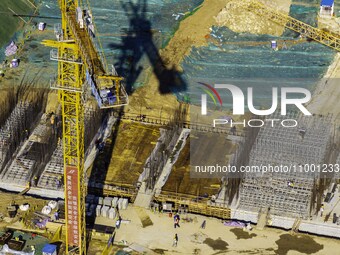 Workers are reinforcing the Yundong Gate at the construction site for the Subei Irrigation Canal in Huai'an, China, on February 16, 2024. (