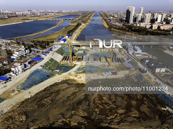 Workers are reinforcing the Yundong Gate at the construction site for the Subei Irrigation Canal in Huai'an, China, on February 16, 2024. 