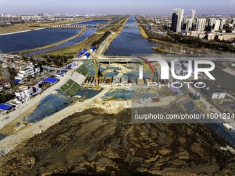 Workers are reinforcing the Yundong Gate at the construction site for the Subei Irrigation Canal in Huai'an, China, on February 16, 2024. (