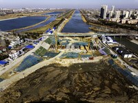 Workers are reinforcing the Yundong Gate at the construction site for the Subei Irrigation Canal in Huai'an, China, on February 16, 2024. (