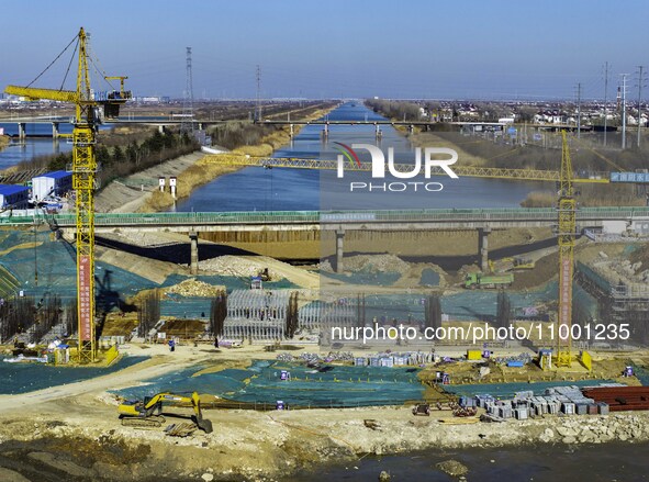 Workers are reinforcing the Yundong Gate at the construction site for the Subei Irrigation Canal in Huai'an, China, on February 16, 2024. 