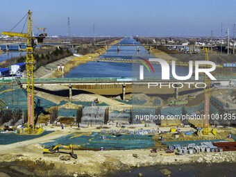 Workers are reinforcing the Yundong Gate at the construction site for the Subei Irrigation Canal in Huai'an, China, on February 16, 2024. (