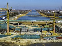 Workers are reinforcing the Yundong Gate at the construction site for the Subei Irrigation Canal in Huai'an, China, on February 16, 2024. (